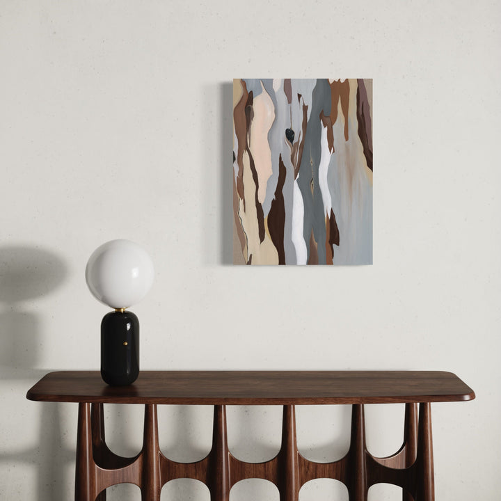 The artwork 'Through You I Hear the Earth' by Taylor Stoneman features flowing, vertical abstract forms in muted earth tones. Gentle curves of brown, grey, and white interweave organically, creating a fluid composition reminiscent of natural formations. The oil on linen painting displays smooth blending and subtle color transitions, mounted above a mid-century modern wooden console.