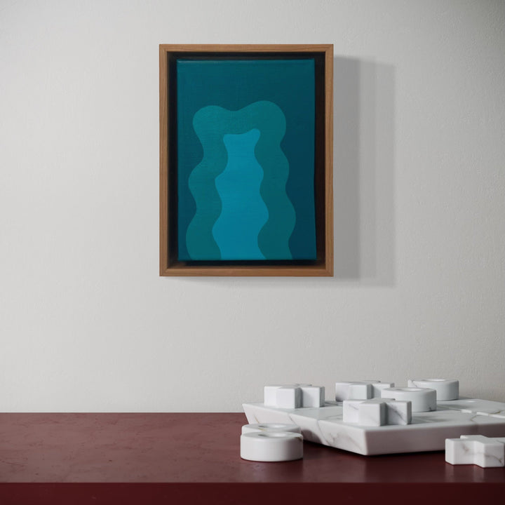 A photo of the artwork Turquoise Mini, by Shadia Sabagh, hanging on a wall.