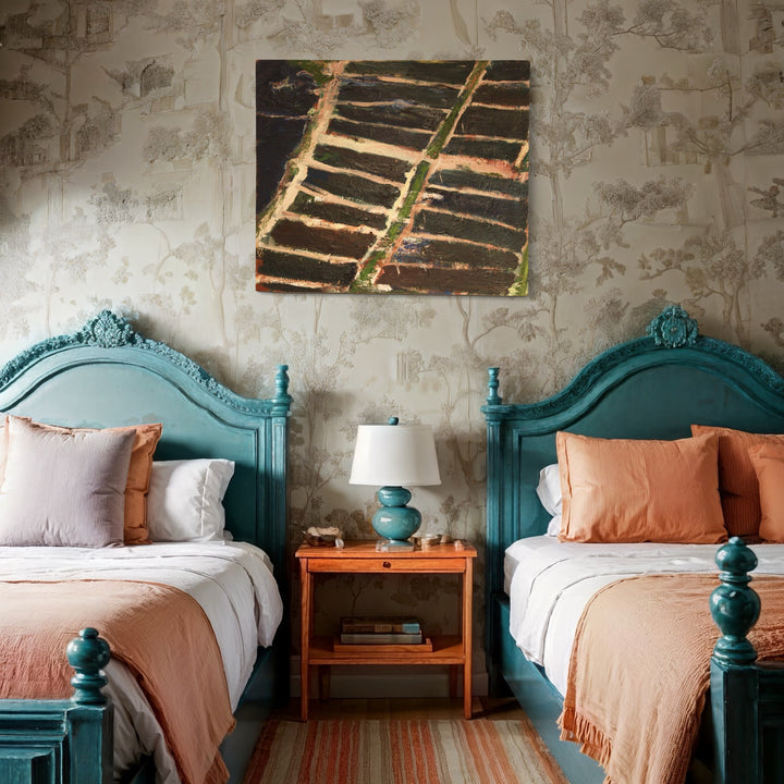 The artwork 'Water Grid' by Christopher Blyth depicts abstract horizontal lines in earthy browns and blacks on linen, mounted above twin teal-painted vintage beds. The oil painting creates a striking contrast with its linear pattern against the bedroom's soft coral bedding and ornate headboards, measuring 43.25 x 50.25 inches. - Christopher Blyth