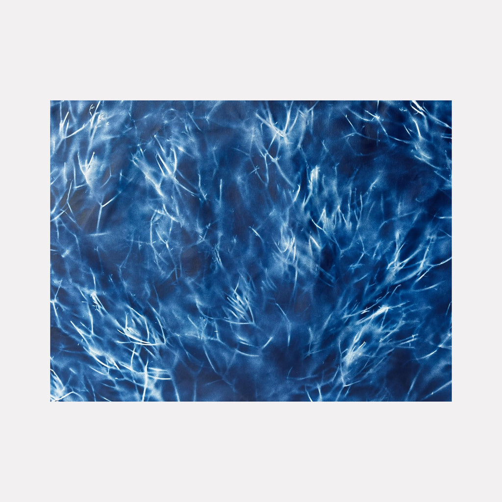 The artwork 'Artemis' by Gina Iannucci features ethereal spray paint strokes creating a mystical underwater effect in deep blue tones. Abstract white wisps and branches dance across the canvas, resembling frost patterns or coral formations, creating depth and movement against the rich navy background. The 36x48 canvas showcases a dynamic interplay of light and shadow.