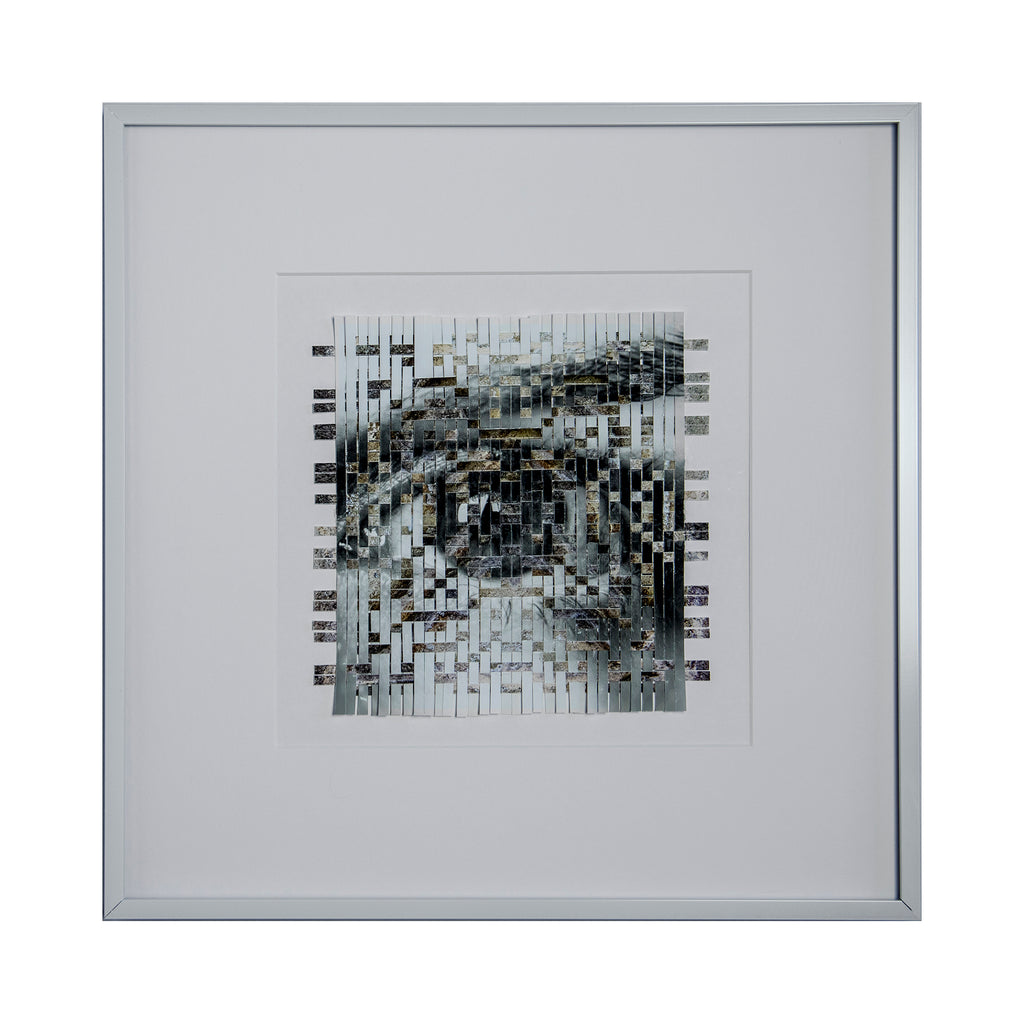 The artwork 'Ancient' by Kiana Honarmand features an intricate woven composition of hand-cut giclee prints in monochromatic tones. The abstract pattern creates a fragmented, pixelated effect using strips of black, white, and gray, arranged in a geometric grid formation. Framed in white, this 16x16 inch piece displays a modernist interpretation of texture and depth.