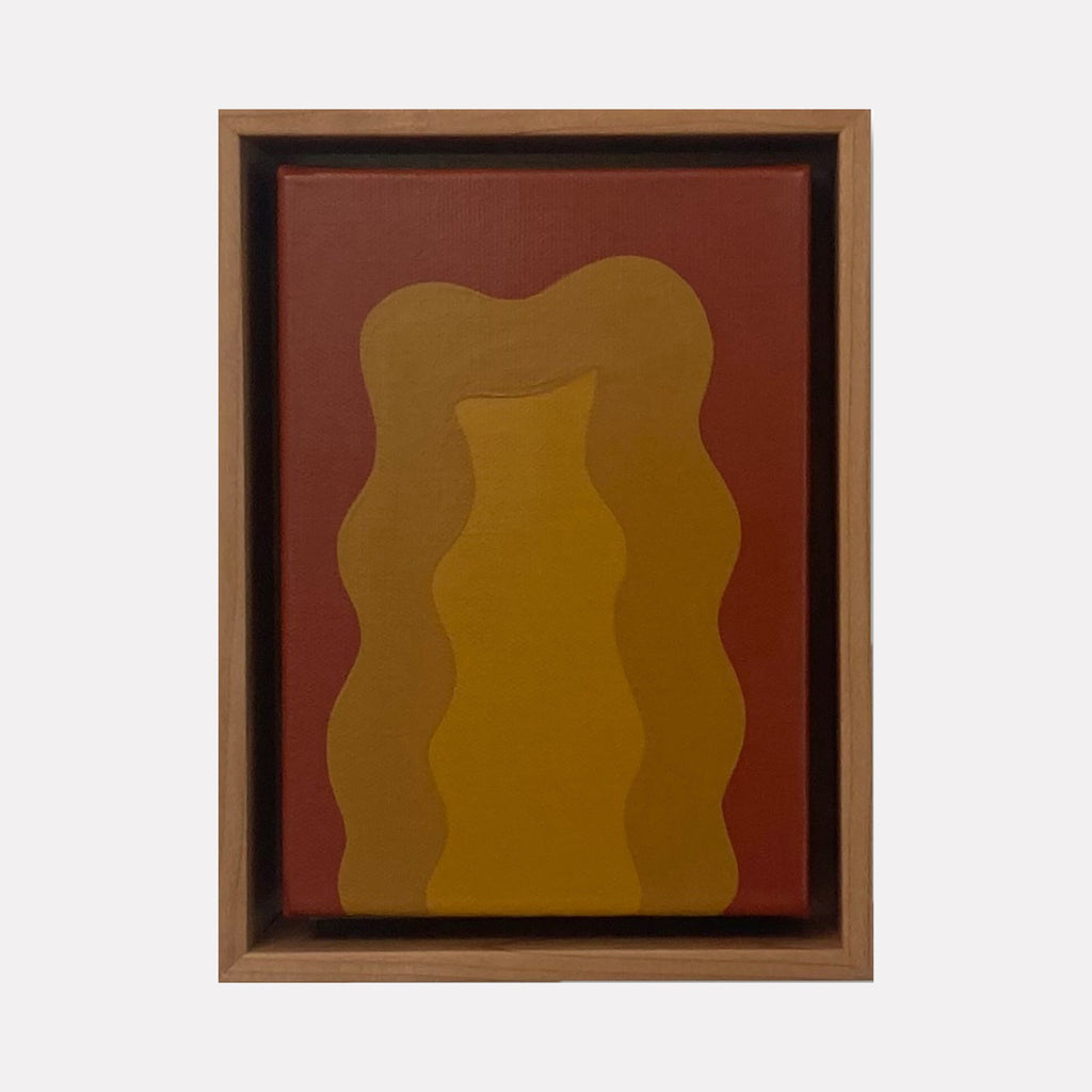 Brown Mini by Shadia Sabagh features abstract wavy forms in rich ochre and golden brown tones against a deep russet background. The minimalist acrylic painting showcases organic, undulating shapes creating a sense of fluid movement and depth within the 8x6 inch canvas, framed in a classic brown wood frame.