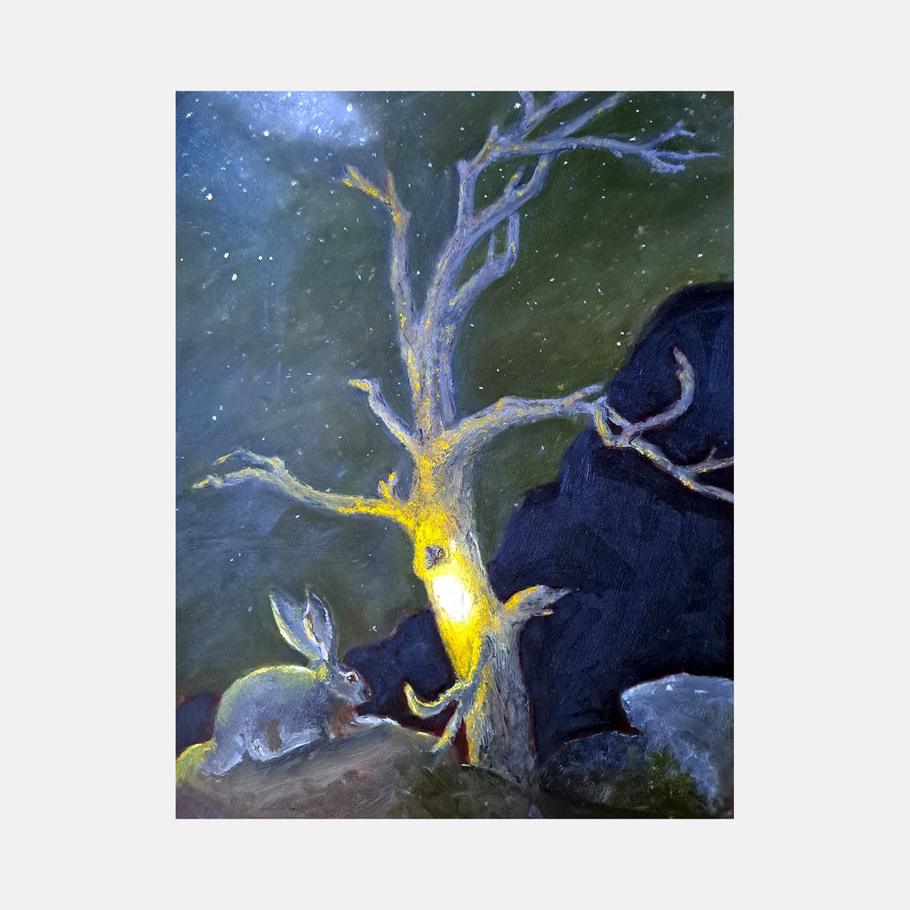 The artwork 'Black Tailed Jackrabbit' by Johanna Ryan depicts a mystical nighttime scene with a gray rabbit near a glowing yellow tree trunk against a deep forest green background. The oil painting on mylar features ethereal starlight, twisted silvery branches, and dark rocky formations, creating a dreamlike woodland atmosphere.