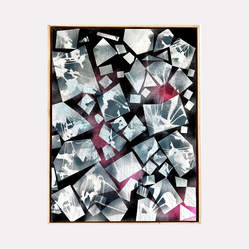 The artwork 'Blackout' by Ann Tarantino features a dynamic composition of fractured geometric shapes in metallic silvers and blacks, punctuated by vibrant magenta accents. Angular fragments create a mosaic-like pattern on the laser-etched panel, suggesting shattered glass or crystalline formations. The acrylic medium adds depth and luminosity to the abstract contemporary design.