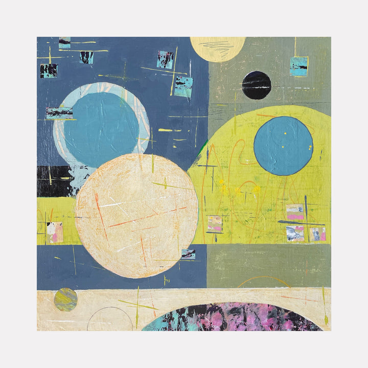 The artwork 'Cosmic Music' by Giliane Bader features abstract circular shapes in varying sizes, including white, turquoise, yellow, and black orbs against a divided background of navy blue and chartreuse. Small geometric elements and textural scratches create a rhythmic composition on mixed media with cold wax finish, suggesting celestial movement and musical harmony.