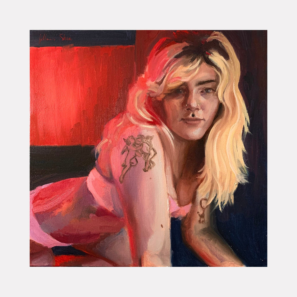 The artwork 'Electric Red' features a contemporary oil painting with vibrant red background and soft pink tones. The composition shows a figure against a dark backdrop, with dramatic lighting and expressive brushwork capturing movement and emotion. The 20x20 inch canvas demonstrates masterful color transitions and modern portraiture techniques by Jillian Shea.