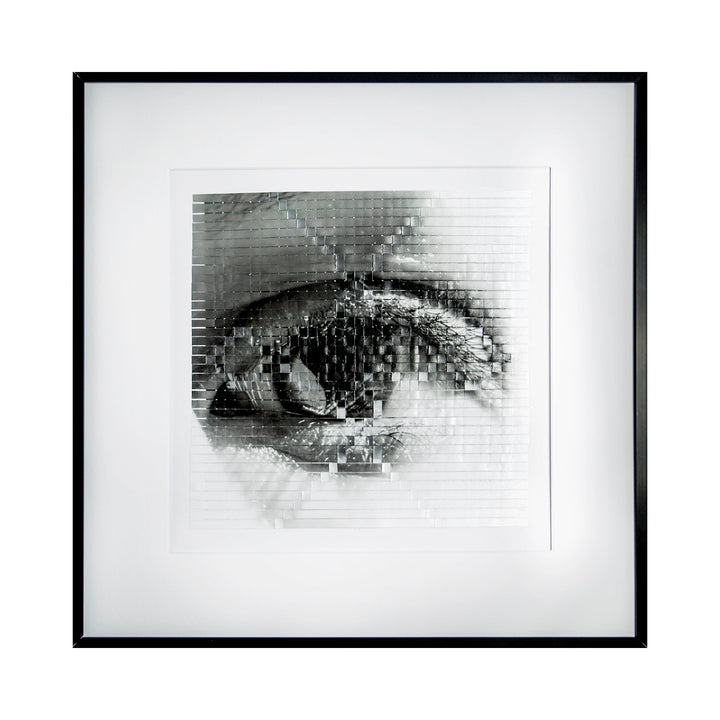 The artwork 'Fracture' by Kiana Honarmand features a striking monochromatic photographic composition of an eye rendered in a pixelated, grid-like pattern. The black and white hand-cut and woven giclee print creates a fragmented, distorted effect, with intricate details highlighting light and shadow. The piece is displayed in a minimalist black frame against a white background.