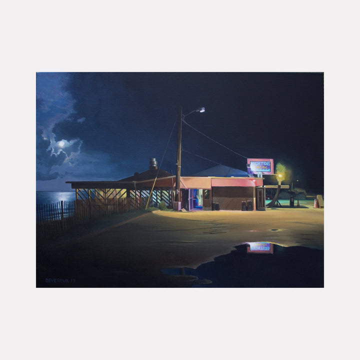 The artwork 'HIGH-TIDES' by Alex Devereux captures a nocturnal coastal scene featuring a beachside establishment under a moody blue night sky. The composition shows a wooden-structured building illuminated by street lamps, with neon signage casting reflections in a puddle. The dramatic lighting creates a stark contrast between warm yellow artificial lights and cool deep blues of the night atmosphere.