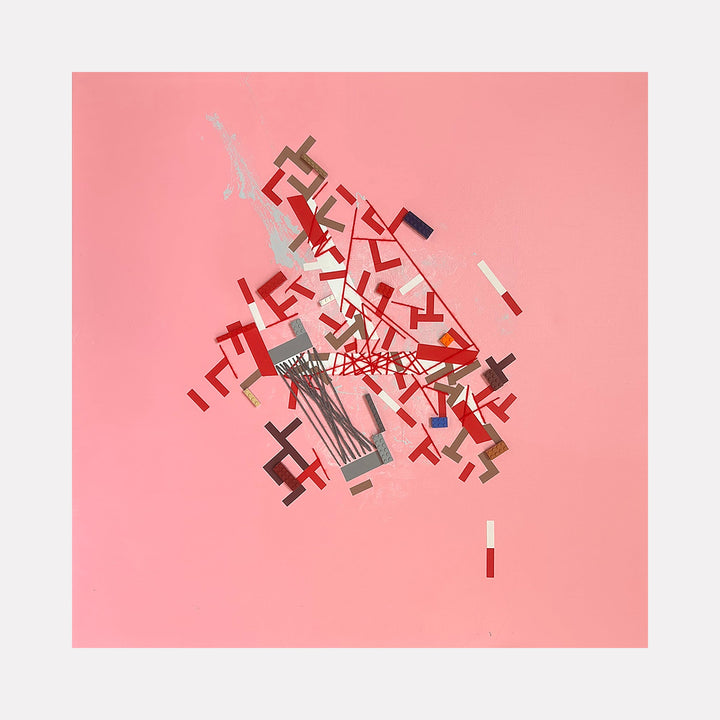 The artwork 'Iiirekiee' by Philippe Halaburda features an abstract geometric composition with angular red and gray shapes scattered dynamically against a soft pink background. The geometric elements appear to burst from a central point, creating a sense of movement and energy through fragmented forms and intersecting lines in mixed media technique.