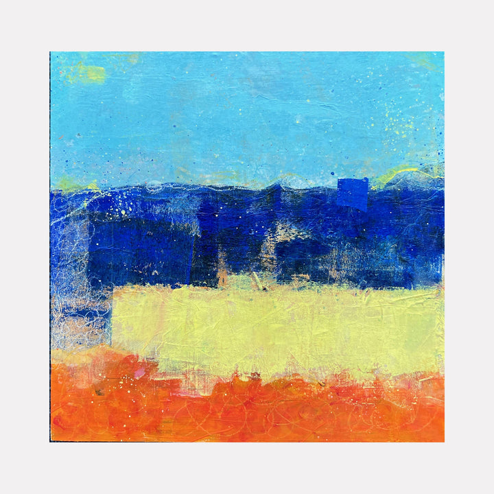 The artwork 'Sapphire Sunset' by Karen L. Burns features bold horizontal bands of color: vibrant turquoise sky, deep cobalt blue mountains, soft yellow horizon, and rich orange foreground. Abstract acrylic painting with textured brushstrokes and mixed media elements create a minimalist landscape composition in a 12x12 inch format.