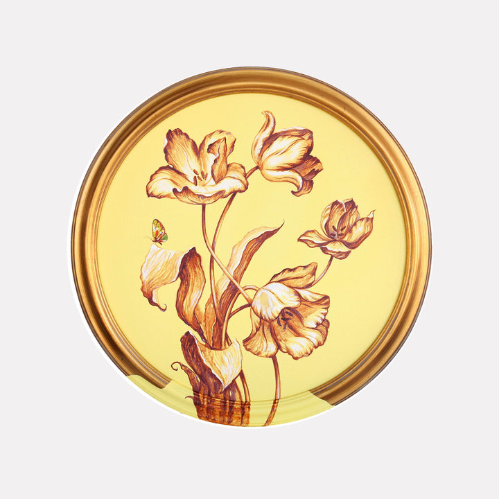 The artwork 'Sunlight' by Carlos Gamez de Francisco features elegant tulip-like flowers rendered in warm sepia tones against a luminous yellow background. The circular composition shows delicate blooms with curling petals and graceful stems, creating a vintage botanical illustration style in acrylic on canvas, measuring 16x16 inches.