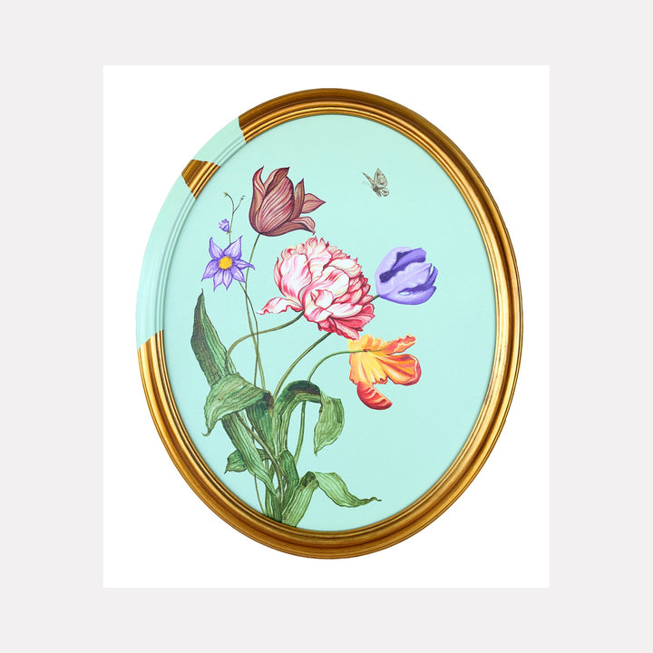 The artwork 'Tulips and Wings II' by Carlos Gamez de Francisco features a delicate botanical composition in an oval golden frame against a mint green background. Colorful tulips in pink, purple, and orange hues stand gracefully with green stems and leaves, accompanied by a small purple daisy and a delicate butterfly, rendered in a detailed watercolor style on acrylic canvas.