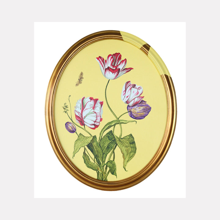 The artwork 'Tulips and Wings I' by Carlos Gamez de Francisco features delicate tulip blooms in pink, white, and purple hues against a soft yellow background. Green stems and leaves support the botanical arrangement, while small butterflies hover near the flowers. The composition is presented in an elegant oval gold frame, showcasing a botanical illustration style in acrylic on canvas.