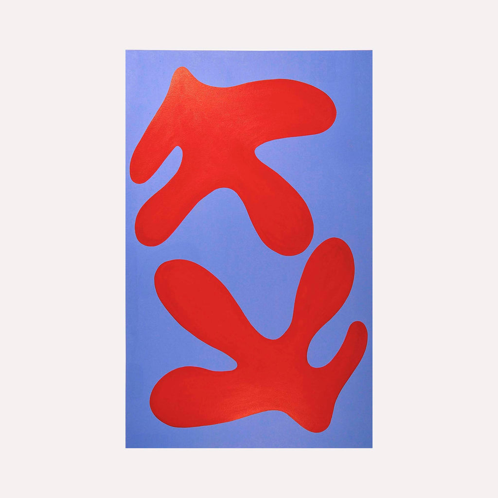 The artwork 'FERN I' by Shadia Sabagh features bold organic shapes in vibrant red against a serene periwinkle blue background. Two abstract fern-like forms float symmetrically on the canvas, creating a minimalist yet dynamic composition. The acrylic painting showcases clean edges and flat color application, measuring 30 x 48 inches.