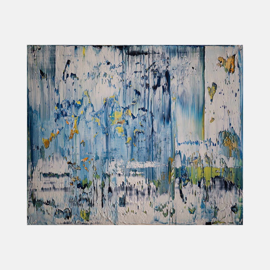 The artwork 'Abstract Indigo 2' by Harry Moody features dramatic vertical brushstrokes in shades of deep indigo and azure blue, layered with white textural elements creating a sense of cascading water. Golden accents and pale green highlights add depth to the 24x20 inch oil painting, with a weathered, contemporary abstract expressionist style on canvas.