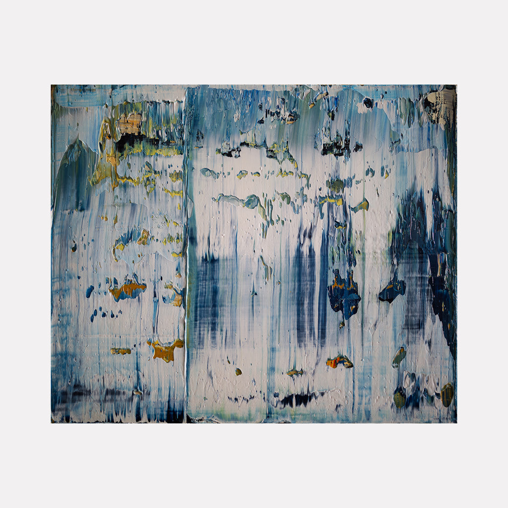 The artwork 'Abstract Indigo 3' features dynamic vertical brushstrokes in varying shades of indigo and white, creating a sense of downward movement. Textural elements include speckled golden accents and deep navy patches against a weathered white backdrop, executed in oil on canvas with an expressionist style by Harry Moody.