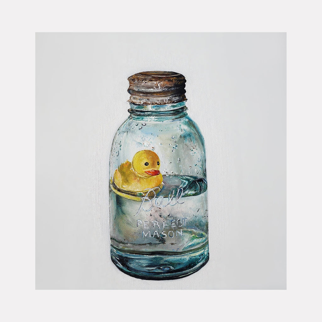 The artwork 'As A Duck Takes To Water' by Shweta Matai features a realistic oil painting of a yellow rubber duck floating inside a vintage blue Ball mason jar with rustic metal lid. The translucent glass jar shows subtle water reflections and embossed text, while the duck is rendered with delicate attention to detail against the soft aqua tones.