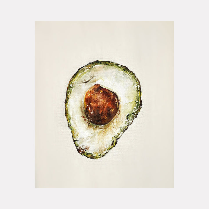 The artwork 'BRAVOCADO' by Shweta Matai features a realistic oil painting of a halved avocado against a cream background. The painting captures the creamy white flesh, rich brown pit, and textured green outer skin with masterful brushstrokes and rich tonal variations, showcasing both botanical detail and artistic expression.