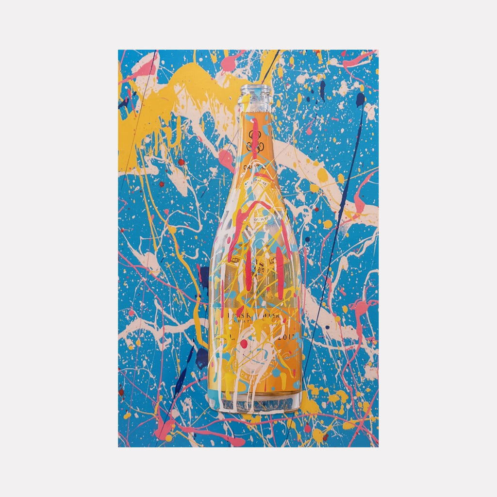 The artwork 'C-12' by Jean-Remi Barbier features a vibrant digital photograph of a glass bottle against a dynamic blue background. The composition showcases expressive paint splatter patterns in yellow, pink, and white, creating an abstract and energetic effect around the central bottle form, reminiscent of pop art and action painting styles.