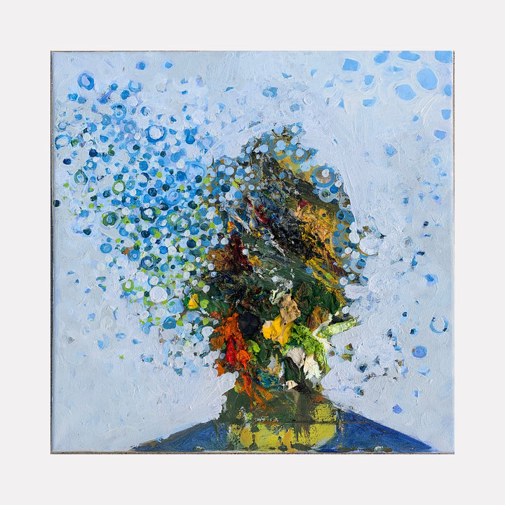 The artwork 'Daydream' by Matthew Cramer features an abstract profile silhouette dissolving into vibrant particles. Blue dots scatter across a pale sky background, while the central figure bursts with orange, yellow, and green hues. Oil paint creates rich texture and dimensional effects on the 14x14 inch canvas, capturing a dreamlike state of transformation.