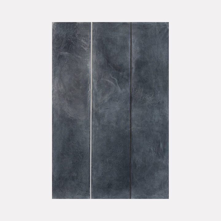 The artwork 'Erasure 31' by Erika Mahr features minimalist vertical lines dividing a moody charcoal-gray composition. Textural elements created with charcoal and paint blend across the surface, creating subtle variations in tone and depth. Two precise white lines bisect the dark atmospheric panel, demonstrating refined technique in mixed media. By Erika Mahr.