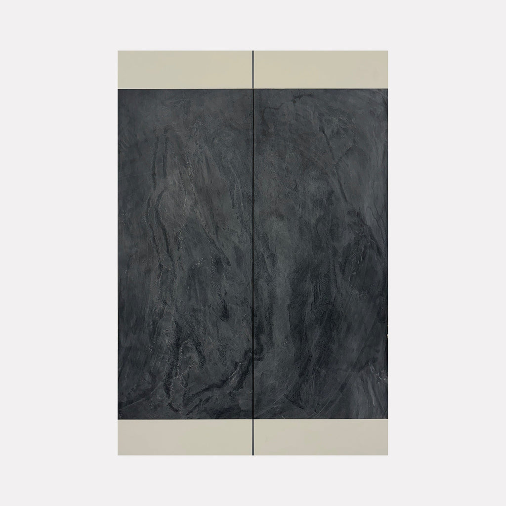 The artwork 'Erasure 43' by Erika Mahr features a vertical diptych composition with textured charcoal and paint on panel. Dark slate-gray central panels with rich, organic textures are framed by clean white borders, creating a minimalist abstract aesthetic with subtle variations in surface depth and materiality.