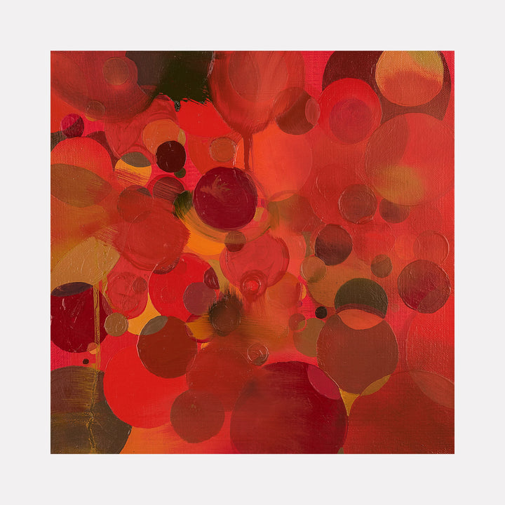 The artwork 'Garnet' by Lisa Ingram features vibrant overlapping circles in deep red, burgundy, and amber hues, creating a dynamic abstract composition. Oil paint texture adds depth to floating spherical forms against a warm orange background, suggesting movement and energy in this 14x14 inch contemporary piece.