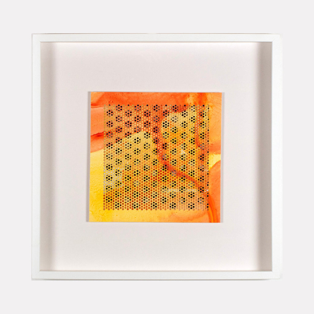 The artwork 'Hay' by Margaret Griffith features a vibrant geometric pattern of small hexagonal perforations on cut paper, set against a warm gradient background transitioning from bright orange to sunny yellow. The 19.75-inch square acrylic piece is displayed in a crisp white frame, creating a modern, minimalist composition reminiscent of honeycomb structures.