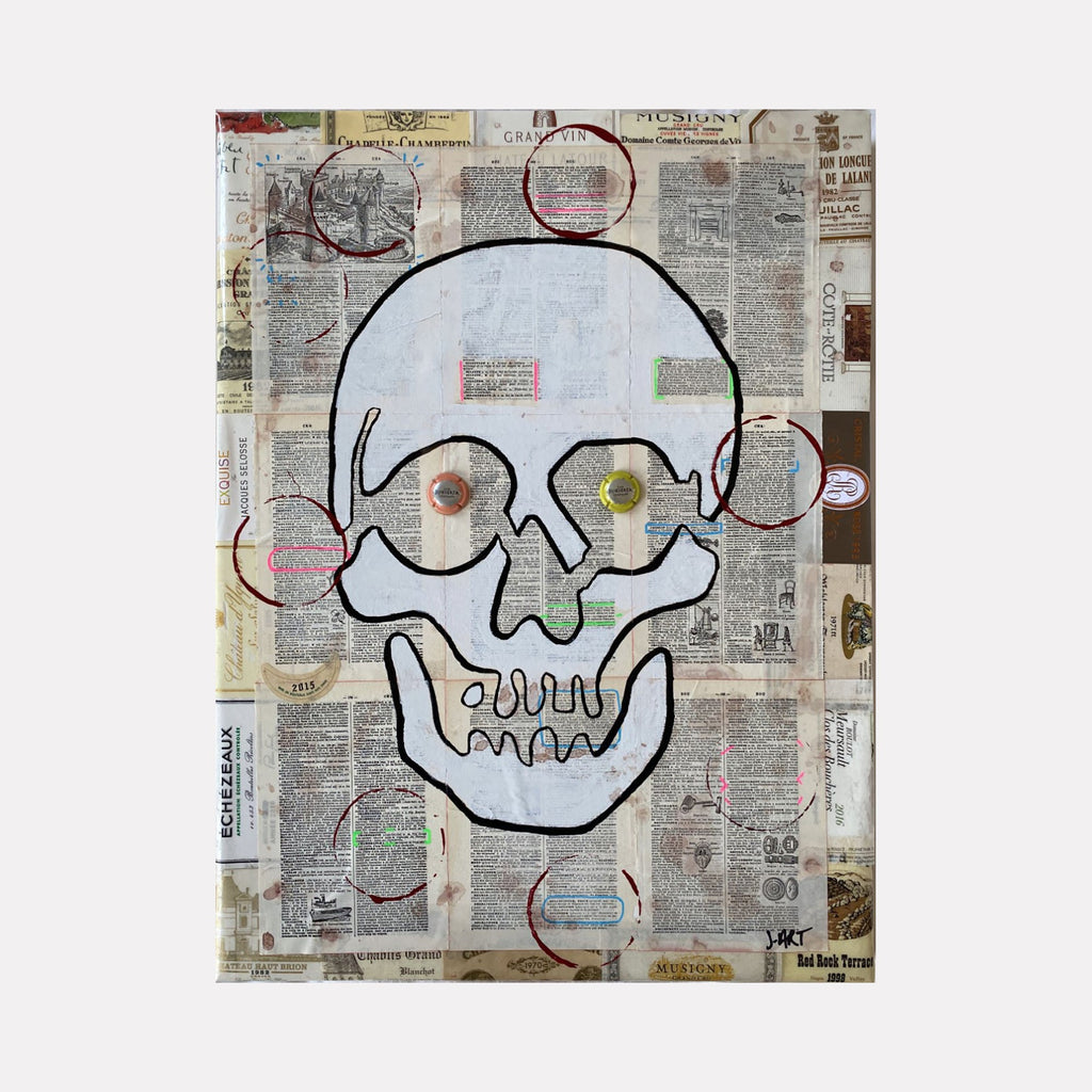 The artwork 'In Vino Veritas' by Jean-Remi Barbier features a bold, minimalist skull drawing outlined in black against a collaged background of vintage newspaper clippings. The skull's eye sockets contain colorful circular elements in orange and yellow, creating a playful contrast with the stark linear design. Mixed media technique combines acrylic paint with layered text and circular markings in muted pink tones.