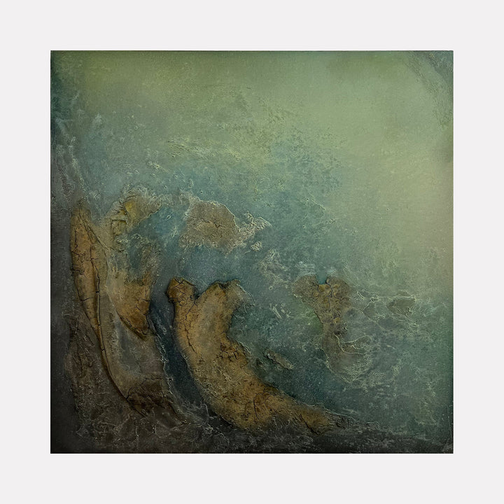 The artwork 'Ogygia' by Abbey Stace features a textural abstract landscape in muted teal and earthy browns. The mixed media piece combines plaster and paint to create a weathered, coastal-inspired surface with organic formations reminiscent of eroded cliffs and misty seas. The rich textures and layered materials create depth and movement across the 40x40 inch canvas.