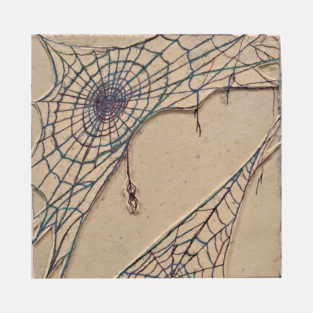 The artwork 'Spiderweb' by Johanna Ryan features an intricate blue-tinted spider web pattern on beige paper. The monotype print showcases delicate spiral lines radiating from a central point, with thin intersecting strands creating a geometric network. A small spider detail hangs from one of the web strands, adding depth to this 8x8 inch trace monotype composition.