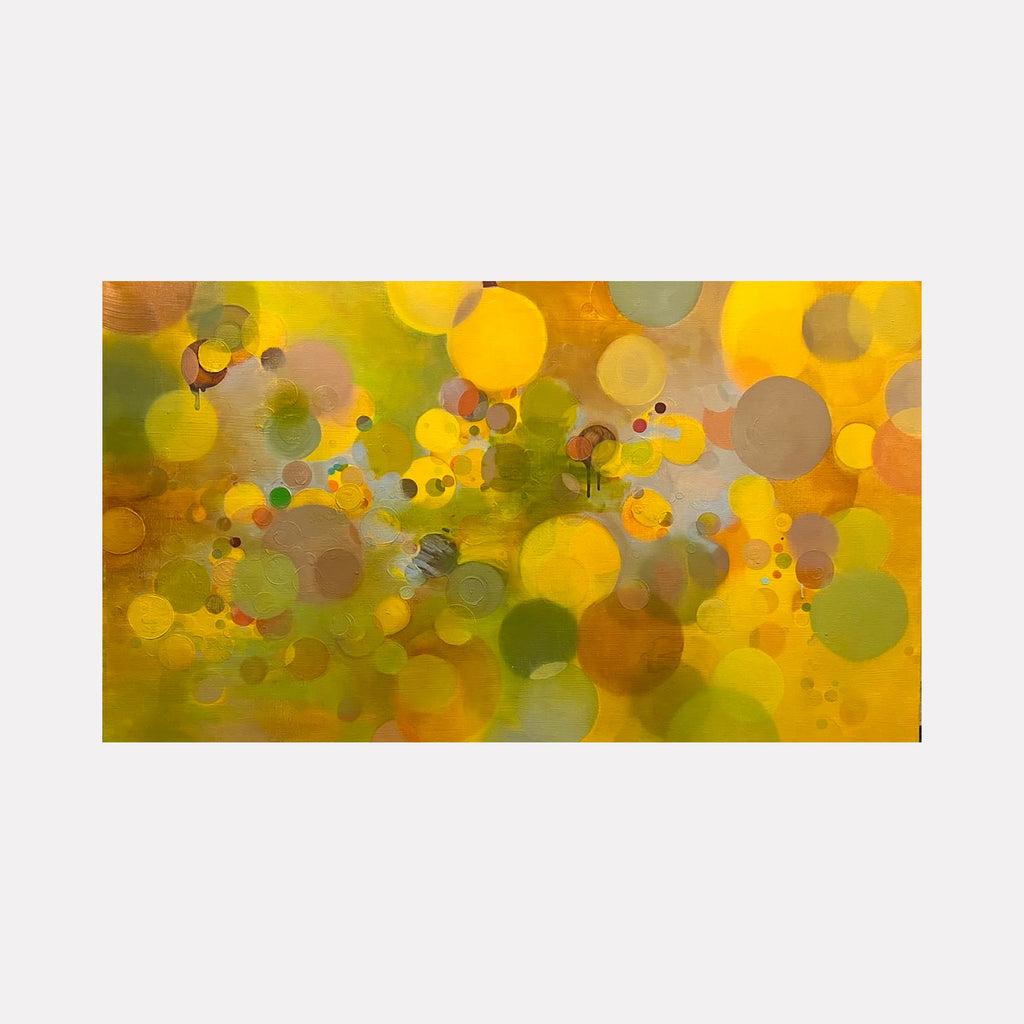 The artwork 'Yellow Paradigm' by Lisa Ingram features vibrant abstract circles in golden yellow and olive green hues, creating a bokeh-like effect. Floating translucent orbs of varying sizes overlap across the canvas, with subtle brown and amber accents adding depth. The oil painting creates a dreamy, ethereal atmosphere through its layered circular forms and luminous color palette. By Lisa Ingram.