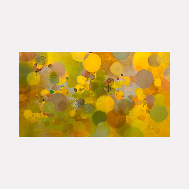 The artwork 'Yellow Paradigm' by Lisa Ingram features vibrant abstract circles in golden yellow and olive green hues, creating a bokeh-like effect. Floating translucent orbs of varying sizes overlap across the canvas, with subtle brown and amber accents adding depth. The oil painting creates a dreamy, ethereal atmosphere through its layered circular forms and luminous color palette. By Lisa Ingram.