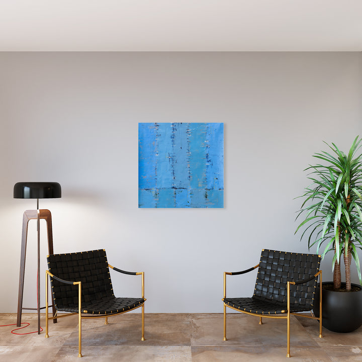 The artwork 'Chromatic Blues' by Shira Toren features a vibrant blue abstract composition with textural vertical elements created using Venetian plaster on canvas. The artwork displays varying shades of azure and cerulean, with subtle darker marks creating depth and movement across the 36x36 inch surface, evoking a serene and contemplative atmosphere.