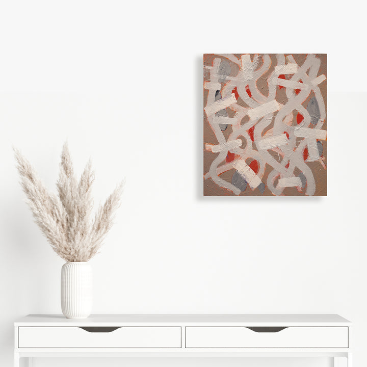 The artwork 'End of Season' by Julie Shapiro features abstract brushstrokes in soft beige and gray tones with striking red accents, creating an intricate pattern of interwoven curved lines and geometric shapes on a warm brown canvas. The textured oil painting demonstrates fluid movement and organic forms, measuring 21 inches by 18 inches.