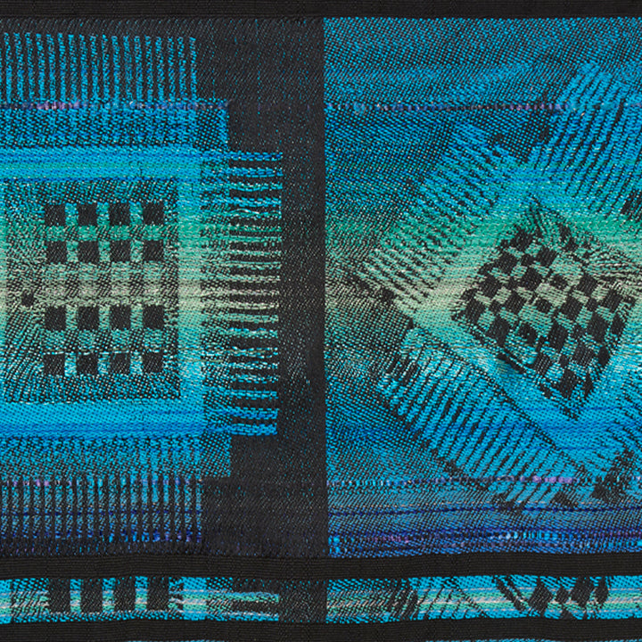 The artwork 'Eyes to See the Soul' by Robin Kang features geometric patterns in vibrant turquoise and black, created through hand jacquard weaving. Abstract checkerboard motifs float on a deep background, with metallic threads adding luminous texture. The composition combines digital-inspired designs with traditional textile techniques, showcasing intricate weaving in cotton, wool, and satin yarns.