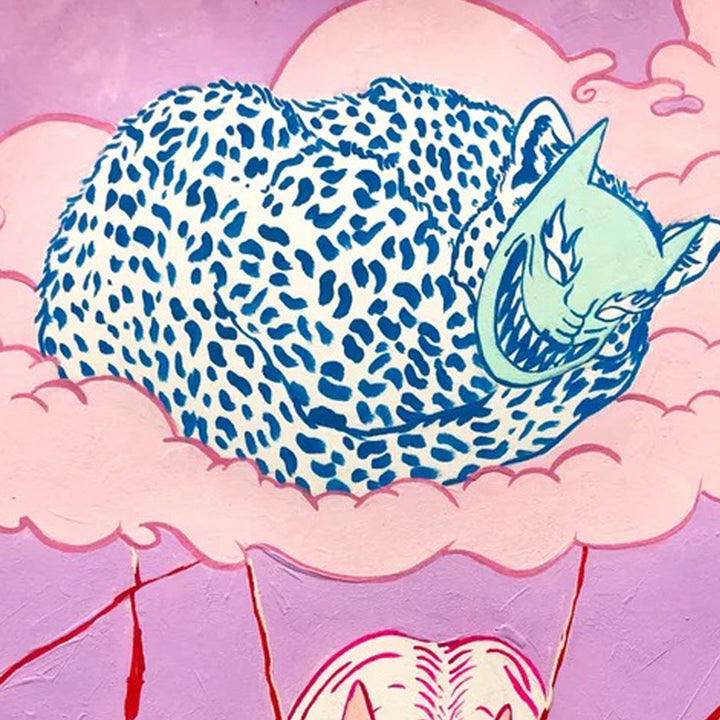 The artwork 'Glass Breaks like People Do' by Eriko Hattori features a whimsical illustration of a sleeping cat with blue spotted patterns resting on pink clouds. The cat appears in a mint green hue with distinctive markings, painted in gouache with a dreamy, surreal style against a soft rose-colored background.