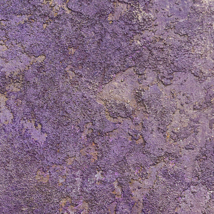 The artwork 'Interference II' by Jacqueline Ferrante features a rich textural composition of deep purple and lavender hues with iridescent gold accents. The acrylic painting on birch panel creates an abstract, weathered surface reminiscent of aged metal or mineral formations, with scattered metallic highlights adding depth and dimension to the 6x6 inch piece.