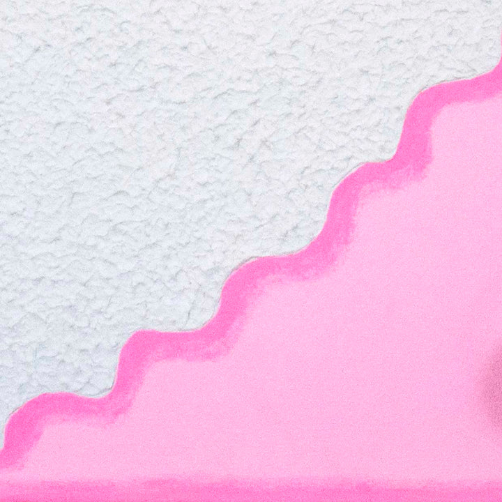 The artwork 'Loopy Cocktail Burp' by Ryan Patrick Martin features a striking diagonal composition split between textured white and vibrant pink sections. The wavy borderline creates a playful, undulating effect. The surface displays a unique tactile quality, with the white area showing a rough, stucco-like texture against the smooth, bright pink section.