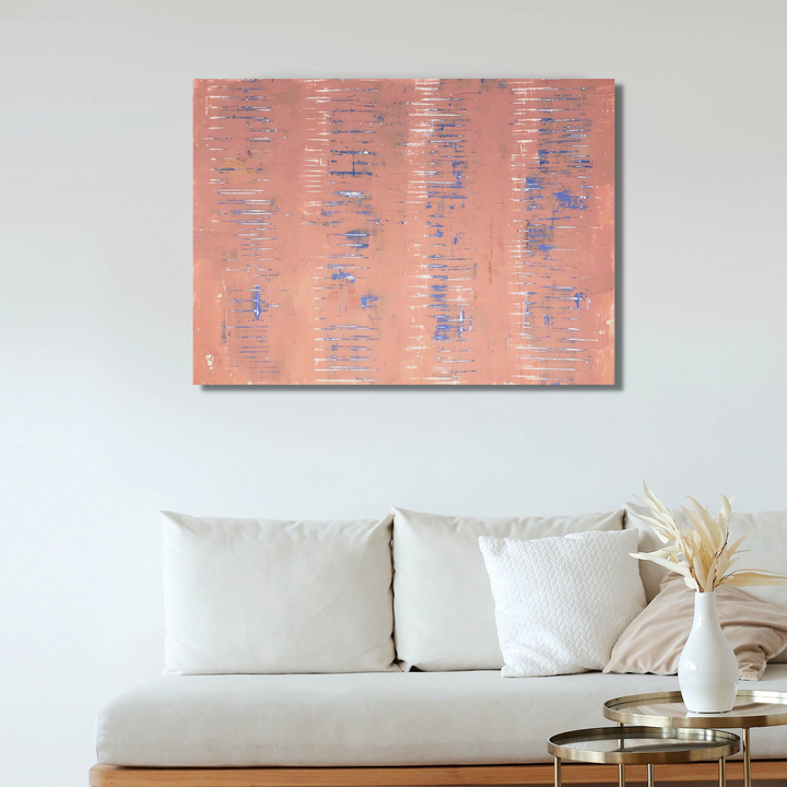 The artwork 'Milk and Honey' by Shira Toren features a soft coral pink background with delicate blue horizontal striations scattered across the canvas. Created with Venetian plaster and pigments, the textured surface creates a gentle, ethereal effect reminiscent of weathered walls. The 36x48 inch piece displays a minimalist composition with subtle color variations and organic patterns by Shira Toren.