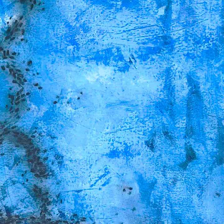 The artwork 'Moving Parts' features vibrant electric blue tones cascading across Venetian plaster, creating a textured abstract composition with subtle dark accents along the edges. The layered technique produces a dynamic, water-like effect with varying depths of cerulean hues. By Shira Toren.