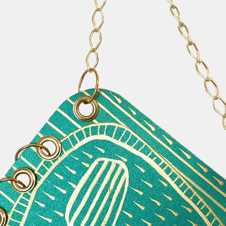 The artwork 'Mr. Rain Face' by Sunny Chapman features a striking turquoise tag design with metallic gold chain links. The tag displays geometric patterns with linear elements and curved motifs in white, creating a modern abstract design. Crafted with acrylic on paper, measuring 12x9 inches, this decorative piece combines artistic detail with contemporary style by Sunny Chapman.