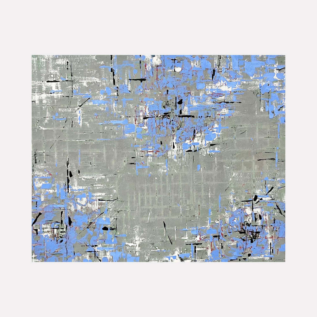 The artwork 'Gift of Blue' by Shira Toren features an abstract composition with a textured gray background accented by scattered patches of powder blue. The print showcases a distressed, modern style with black linear elements creating a fragmented pattern across the 24x30 inch canvas, suggesting a contemporary urban aesthetic.