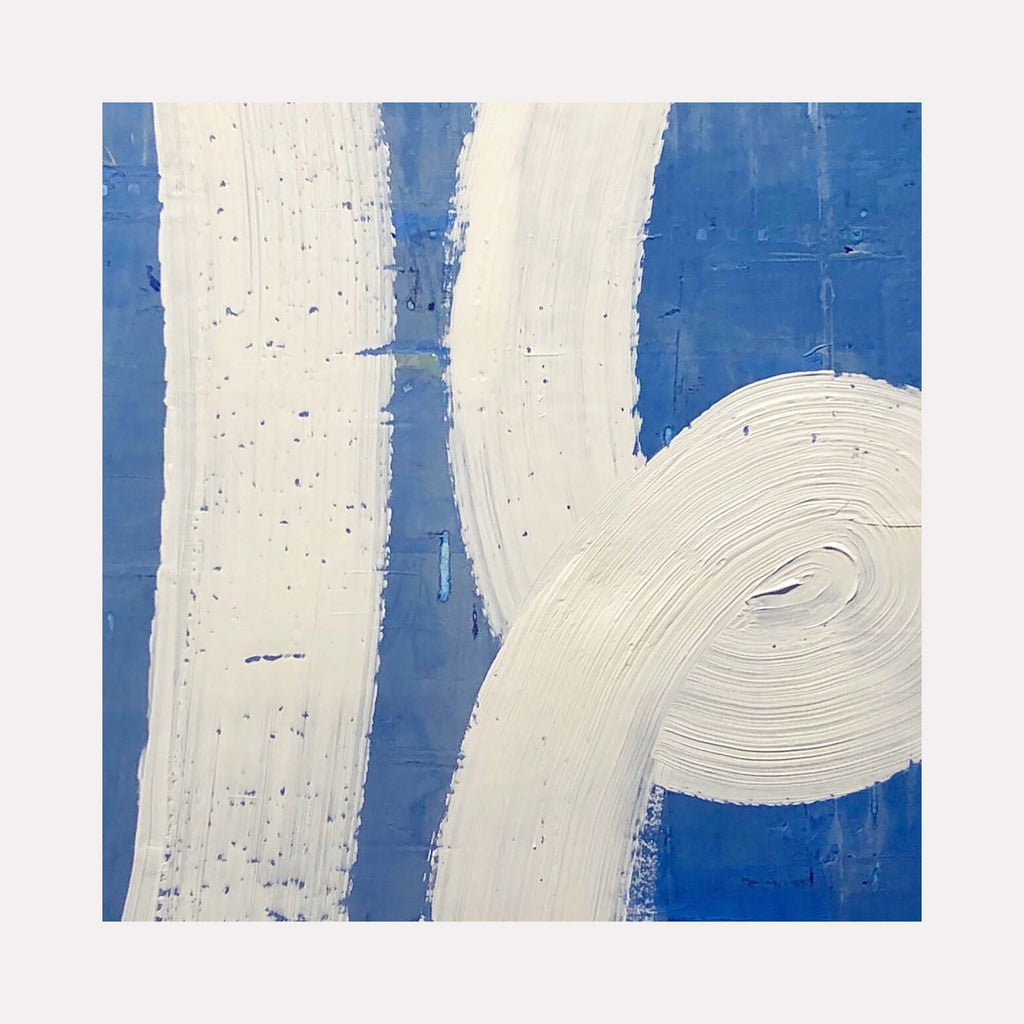 The artwork 'In the Loop' by Shira Toren features bold white curved brushstrokes against a vibrant cobalt blue background. The abstract composition showcases dynamic spiral and linear forms with textural impasto technique, creating a sense of movement and flow. The 24x24 inch print demonstrates a minimalist aesthetic with contrasting colors and expressive painterly elements.