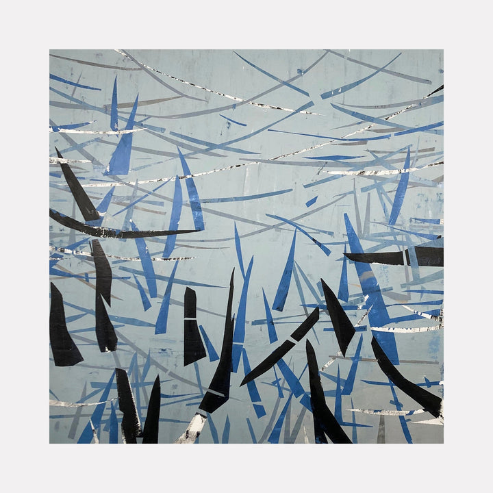 The artwork 'Northeast' by Shira Toren features an abstract composition of intersecting blue and black geometric shapes against a misty gray background. Dynamic brushstrokes create a sense of movement, with angular forms suggesting bamboo or reeds. White highlights add texture and depth to this 50x50 inch contemporary print.