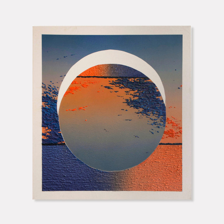 The artwork 'Crescent Beach Eclipse' by Saskia Fleishman features a striking circular composition with textured acrylic and sand elements. A large white crescent frames a dramatic coastal scene, blending deep navy blues and vibrant coral oranges. The textured surface creates a dynamic interplay of light and shadow, evoking a celestial beach landscape during an eclipse moment.