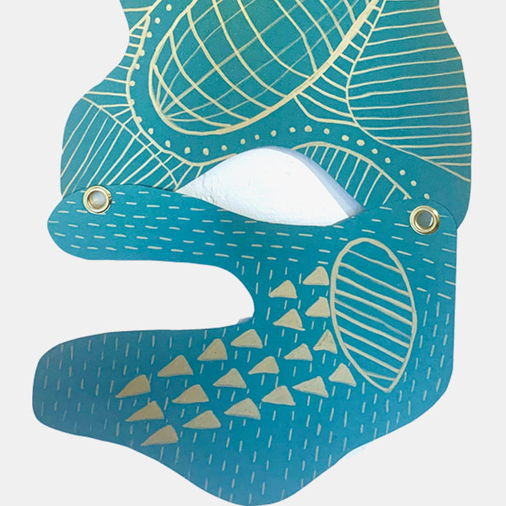 The artwork 'Sloth' by Sunny Chapman features an abstract aqua-blue profile with intricate gold line patterns and geometric shapes. The design incorporates delicate crosshatching, dotted details, and triangular elements on metallic paper. The contemporary piece combines metallic accents with paint marker detailing, showcasing a modern interpretation of a sloth's face in a minimalist style.